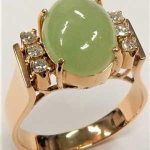 Jade Estate Ring
18 Karat Rosé Jade Ring
Gram Weight 6.5
1 Center Jade 3.86ct Shape: Cabochon With 6 Round Diamonds 0.12 ctw