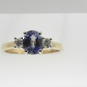 Sapphire Estate Ring 
14 Karat Yellow Blue Sapphire Ring With Finger Size 8.25 
 Gram Weight 2.9 
1 Center Sapphire 1.12ct Shape: Oval; Colour: Blue With 2 Round Diamonds 0.20 ctw