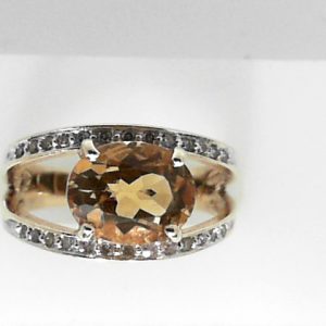 Citrine Estate Ring 
14 Karat Yellow Citrine Ring With Finger Size 7.75 
 Gram Weight 5.5 
1 Center Citrine Shape: Oval With 26 Round Diamonds