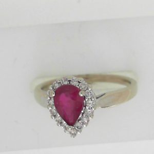 Ruby Estate Ring 
14 Karat White Ruby Ring With Finger Size 6.25 
 Gram Weight 3.22 
1 Center Ruby 0.66ct Shape: Pear With 15 Round Diamonds 0.20 ctw