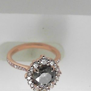 Kristin Coffin Moissanite Estate Ring 
14 Karat Rosé Moissanite Ring With Finger Size 3.75 
 Gram Weight 3.78 
1 Center Moissanite 1.10ct Shape: Round With 32 Round Diamonds 0.59 ctw