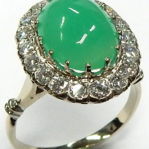 Chrysoparse Estate Ring 
14 Karat White Chrysoparse Ring With Finger Size 7 
 Gram Weight 5.1 
1 Center Chrysoparse 3.00ct Shape: Cabochon With 18 Round Diamonds 0.90 ctw