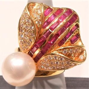 Pearl Estate Ring 
18 Karat Yellow Pearl Ring With Finger Size 7.75 
 Gram Weight 24 
1 Center Pearl Shape: Round With 22 Baguette Rubies 2.71 ctw and 54 Round Diamonds 0.73 ctw
