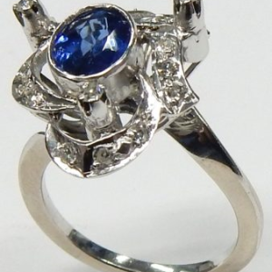 Sapphire Estate Ring 
14 Karat White Blue Sapphire Ring With Finger Size 6 
 Gram Weight 4.1 
1 Center Sapphire 1.15ct Shape: Oval; Colour: Blue With 20 Round Diamonds 0.20 ctw
