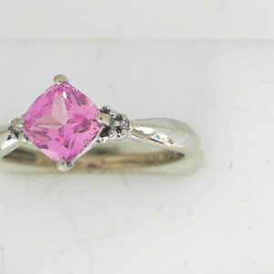 Created Sapphire Estate Ring 
14 Karat White Pink Created Sapphire Ring With Finger Size 7.5 
 Gram Weight 2.12 
1 Center Created Sapphire Shape: Princess; Colour: Pink With 2 Round Diamonds
