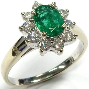 Emerald Estate Ring 
14 Karat White Emerald Ring With Finger Size 6.75 
 Gram Weight 3 
1 Center Emerald 0.58ct Shape: Oval With 10 Round Diamonds 0.50 ctw