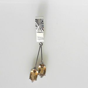 Citrines Estate Pendant 
18 Karat White Citrines Pendant 
Gram Weight 4 Chain Style: No Chain 
2 Center Citrines Shape: Oval With 4 Round Diamonds