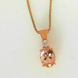 Morganite Estate Pendant 
14 Karat Rosé Moissanite Pendant 
Gram Weight 3.5 Chain Style: Wheat 14 Karat Rosé Length: 18in 
1 Center Morganite Shape: Oval With 1 Round Diamond 0.07 ctw