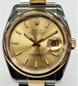 Estate Rolex Dress Year: 2004
Vendor Style #: 116203 SN: F382522 Oyster
36mm 18K/Stainless Steel
Dial: Champagne hash 
Box Included/Papers Included
Condition Very Good
1 Year Warranty