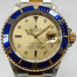 Estate Rolex Divers Year: 2001
Vendor Style #: 001-22393-001 Serti Champagne SN: K882076 Bracelet
40mm 18K/Stainless Steel
Dial: Champagne diamonds sapphires 
Box Not Included/Papers Not Included
Condition Very good
1 Year Warranty