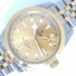 Estate Rolex Dress 
Vendor Style #: 79503 Black Bay 36 two tone SN: i973722 Bracelet (short)
36mm 18K/Stainless Steel
Dial: Champagne plots 
Box Included/Papers Included
Condition Good
1 Year Warranty