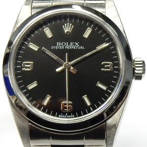 Estate Rolex Dress Year: 2001
Vendor Style #: 77080 OP 31 "Explorer" SN: K802226 Oyster
31mm StainlessSteel
Dial: Black hash Arabic 
Box Not Included/Papers Not Included
Condition Excellent
1 Year Warranty