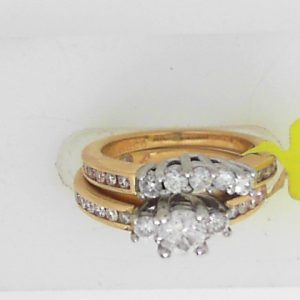 Estate Diamond Engagement Ring 
14 Karat Yellow/White Estate Engagement Ring 
Finger Size 4 Gram Weight 7.8 
 Center Diamond Shape: Round 0.7