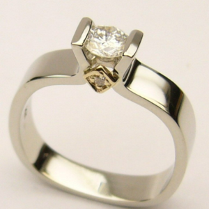 Estate Diamond Engagement Ring 
14 Karat Yellow/White Estate Engagement Ring 
Finger Size 6.75 Gram Weight 4.3 
3 Center Diamonds Shape: Round; Clarity: SI2; Colour: G 0.33