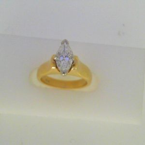 Estate Diamond Engagement Ring 
18 Karat Yellow/White Estate Engagement Ring Width 3.2mm 
Finger Size 4 Gram Weight 5.9 
1 Center Diamond 0.83ct Shape: Marquise; Clarity: SI1; Colour: F/G 0.83