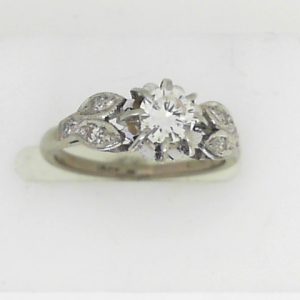 Estate Diamond Engagement Ring 
18 Karat White Estate Engagement Ring 
Finger Size 5.5 Gram Weight 3.04 
1 Center Diamond 0.30ct Shape: Round; Clarity: VS; Colour: I/J With 6 Round Diamonds 0.03 ctw 0.33