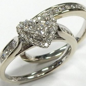 Estate Diamond Engagement Ring 
14 Karat White Estate Engagement Ring 
Finger Size 7 Gram Weight 7 
46 Center Diamonds Shape: Various Shapes; Clarity: SI; Colour: I 0.75