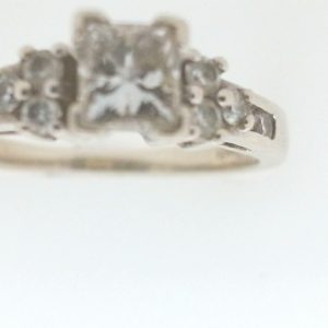 Estate Diamond Engagement Ring
14 Karat White Estate Engagement Ring
Finger Size 6.75 Gram Weight 3
1 Center Diamond 0.46ct Shape: Princess; Clarity: VS2; Colour: F; GIA 2151741567 With 10 Round Diamonds 0.28 ctw 0.74
