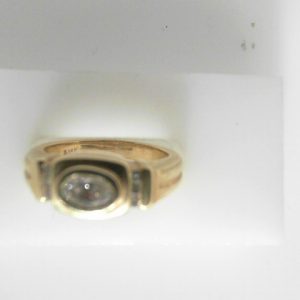 Estate Diamond Ring - Men's 
14 Karat Yellow Estate Diamond Ring 
Finger Size 6.5 Gram Weight 6.55 
1 Center Diamond 0.50ct Shape: Oval; Clarity: VS; Colour: H With 6 Round Diamonds 0.08 ctw 0.58