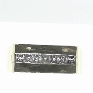 Estate Diamond Ring - Men's 
14 Karat Yellow Estate Diamond Ring Width 7.5mm 
Finger Size 12.25 Gram Weight 8.42 
7 Center Diamonds Shape: Round; Clarity: VS; Colour: I 0.75