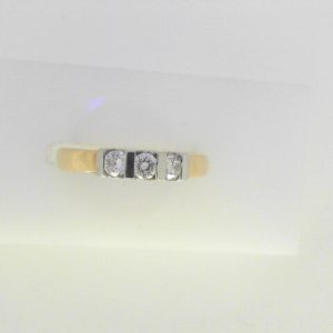 Diamond Wedding/Anniversary Ring 
14 Karat Yellow Wedding/Anniversary Ring Width 2.3mm 
Finger Size 6.25 
3 Center Diamonds Shape: Round 0.25