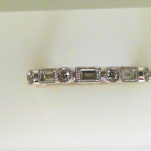 Diamond Wedding/Anniversary Ring 
18 Karat White Wedding/Anniversary Ring 
Finger Size 6.5 
 Center Diamond Shape: Various Shapes 0.47