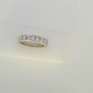 Diamond Wedding/Anniversary Ring 
18 Karat White Wedding/Anniversary Ring 
Finger Size 6.5 Gram Weight 6.5 
7 Center Diamonds Shape: Princess; Clarity: VS; Colour: I 1.44