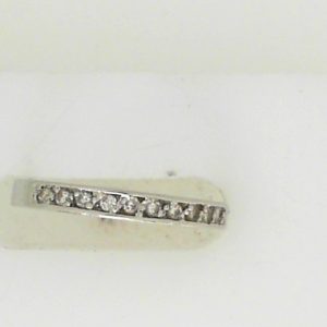 Estate Diamond Anniversary Ring 
Platinum White Estate Anniversary Ring 
 Gram Weight 3.37 
10 Center Diamonds Shape: Round; Clarity: SI1; Colour: H 0.1