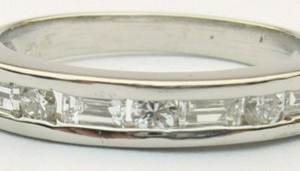 Estate Diamond Anniversary Ring 
Platinum White Estate Anniversary Ring 
Finger Size 5.25 Gram Weight 4 
7 Center Diamonds Shape: Various Shapes; Clarity: VS; Colour: H 0.3