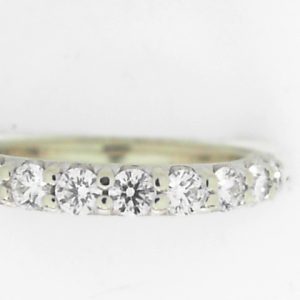 Estate Diamond Anniversary Ring 
14 Karat White Estate Anniversary Ring Width 2.5mm 
Finger Size 5 Gram Weight 2.4 
12 Center Canadian Diamonds 0.06ct Shape: Round; Clarity: VS1; Colour: F 0.72