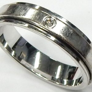 Estate Diamond Anniversary Ring 
18 Karat White Estate Anniversary Ring Width 4.75mm 
Finger Size 7.5 Gram Weight 6.8