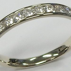 Estate Diamond Anniversary Ring 
14 Karat White Estate Anniversary Ring Width 3mm 
Finger Size 7 Gram Weight 1.8 
10 Center Diamonds Shape: Round; Clarity: I1; Colour: F 0.36