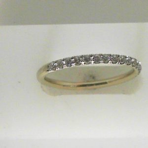 Estate Diamond Anniversary Ring 
14 Karat White Estate Anniversary Ring Width 2mm 
Finger Size 9 Gram Weight 1.96 
17 Center Diamonds Shape: Round; Clarity: SI1; Colour: H 0.33