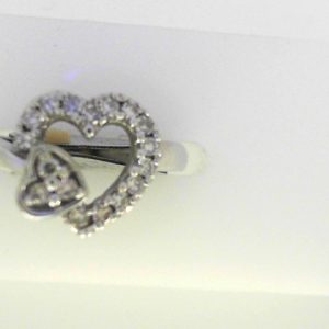 Diamond Dinner Ring - Women's 
10 Karat White Dinner Ring 
Finger Size 5.5 Gram Weight 3.15 
17 Center Diamonds Shape: Round 0.255