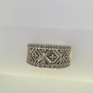 Diamond Dinner Ring - Women's 
10 Karat White Dinner Ring Width 7.2mm 
Finger Size 6.25 Gram Weight 5.9 
47 Center Diamonds Shape: Round 0.4