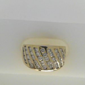 Estate Diamond Dinner Ring - Women's 
14 Karat White Estate Dinner Ring Width 2.8mm 
Finger Size 4.5 Gram Weight 4.2 
43 Center Diamonds Shape: Round; Clarity: I1; Colour: H 0.75