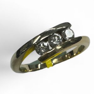 Estate Diamond Dinner Ring - Women's 
14 Karat Yellow Estate Dinner Ring 
Finger Size 5.5 Gram Weight 2.5 
3 Center Diamonds Shape: Round; Clarity: I1; Colour: I/J 0.25