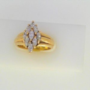 Estate Diamond Dinner Ring - Women's 
14 Karat Yellow Estate Dinner Ring Width 3.5mm 
Finger Size 6.25 Gram Weight 4.9 
9 Center Diamonds Shape: Marquise 0.66