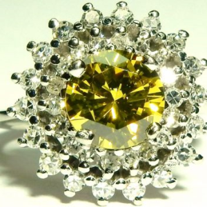 Estate Diamond Dinner Ring - Women's 
14 Karat White Estate Dinner Ring 
Finger Size 5.5 Gram Weight 4.93 
1 Center Diamond; 1.46ct Shape: Round; Clarity: VVS2; GIA 5121011261 With 36 Round Diamonds 0.54 ctw 2