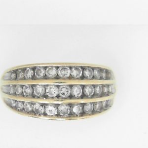 Estate Diamond Dinner Ring - Women's 
14 Karat Yellow Estate Dinner Ring 
Finger Size 7.25 Gram Weight 6.1 
33 Center Diamonds Shape: Round; Clarity: I1; Colour: I 1