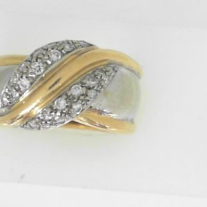 Estate Diamond Dinner Ring - Women's 
18 Karat Yellow/White Estate Dinner Ring 
Finger Size 7.5 Gram Weight 11.28 
24 Center Diamonds Shape: Round; Clarity: SI1; Colour: I 0.25