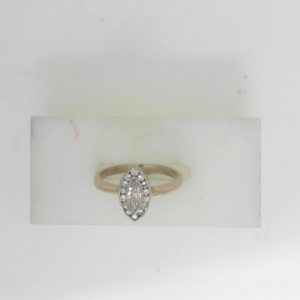 Estate Diamond Dinner Ring - Women's 
14 Karat White Estate Dinner Ring 
Finger Size 6 Gram Weight 2.75 
15 Center Diamonds Shape: Various Shapes; Clarity: VS; Colour: H 0.33