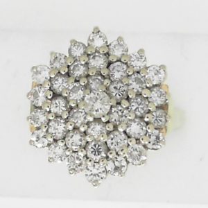 Estate Diamond Dinner Ring - Women's 
14 Karat Yellow Estate Dinner Ring 
Finger Size 7 Gram Weight 7.1 
36 Center Diamonds Shape: Round; Clarity: I1; Colour: I/J 1.75