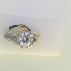 Diamond Semi-Mount Ring 
18 Karat White Ring 
Finger Size 6 
 Center Diamond Shape: Round; Clarity: VS1; Colour: F/G 0.44