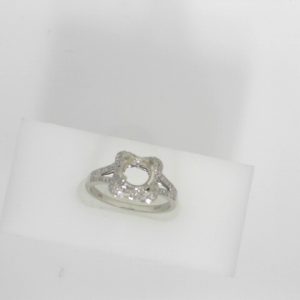 Estate Diamond Semi-Mount 
19 Karat White Estate Semi-Mount Ring 
Finger Size 7 Gram Weight 3.29 
86 Center Diamonds Shape: Round; Clarity: VS; Colour: F/G 0.17