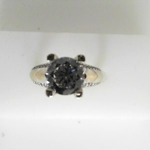 Estate Diamond Semi-Mount 
14 Karat White Estate Semi-Mount Ring Width 8mm 
 Gram Weight 7.9 
1 Center Cubic Zirconium Shape: Round With 88 Round Diamonds 0.22 ctw 0.22