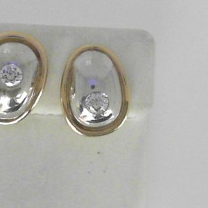 Diamond Earrings 
14 Karat Yellow/White Diamond Earrings 
 
2 Center Diamonds Shape: Round 0.58