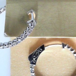 Diamond Earrings 
14 Karat White Diamond Earrings 
Gram Weight 3.46 
42 Center Diamonds Shape: Round 1