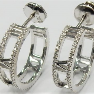 Tiffany & Co. Estate Diamond Earrings 
18 Karat White Estate Diamond Earrings 
Gram Weight 8.6 
180 Center Diamonds Shape: Round 0.7