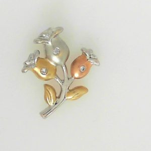 Estate Diamond Pendant/Necklace 
14 Karat Rose/White/Yellow Estate Diamond Pendant 
Gram Weight 2.1 Chain Style: No Chain 
3 Center Diamonds Shape: Round 0.03